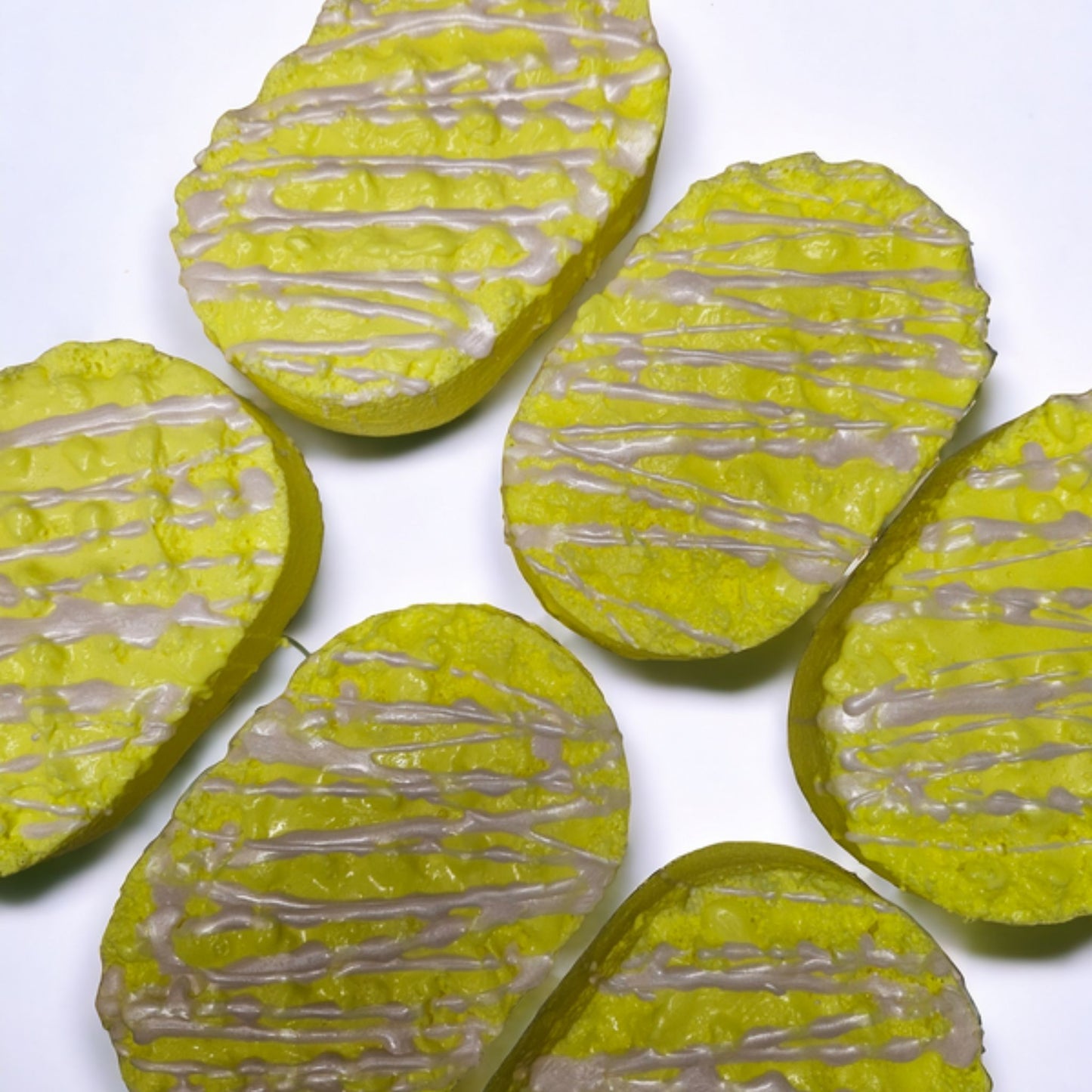 A lush yellow soap loaded sponge with a drizzle of white and infused with the delightful Dazy Flower perfume inspired fragrance.