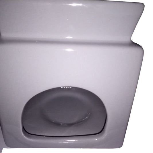 The rear view of the square grey wax or oil warmer where the tea light goes