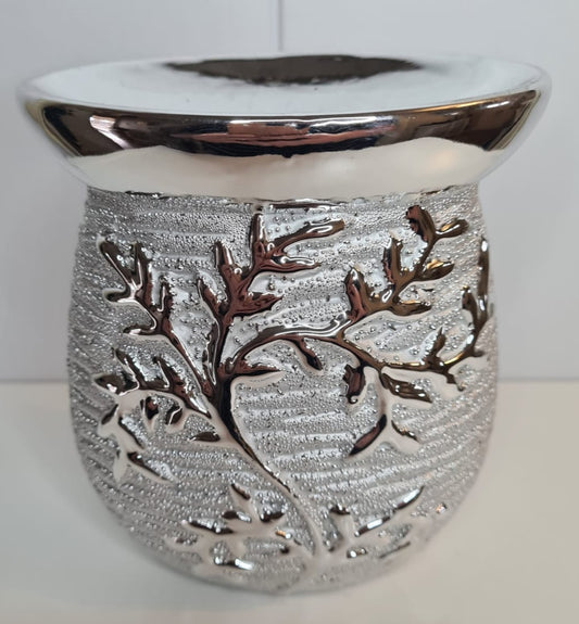 Gun metal silver tone in colour thos burner will fit in with any decor