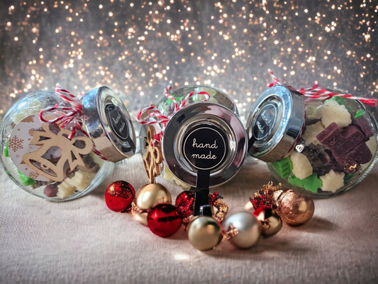 A cute little jar of christmas shaped wax melts in green, red and white in a lovely christmas scent