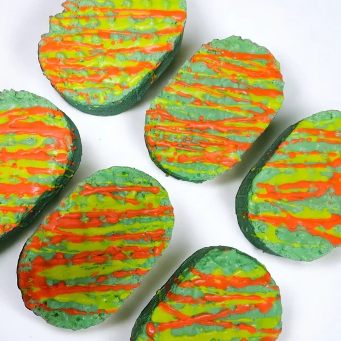 Totally Tropical Soap Infused sponge has been immersed in a green coloured soap infused with the fruity fragrance to decorate it has been drizzled with orange and yellow soap drizzle