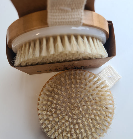 2 views of our bamboo body brush a view from the top and of the round brush side