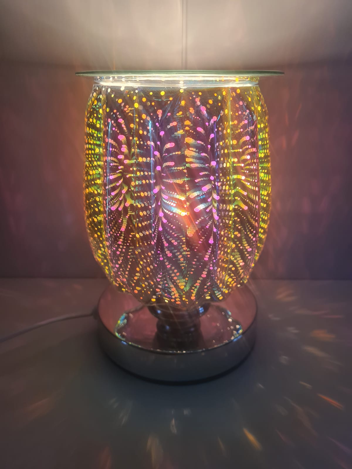 This image shows how the pattern lights up the area around the 3d electric aroma lamp