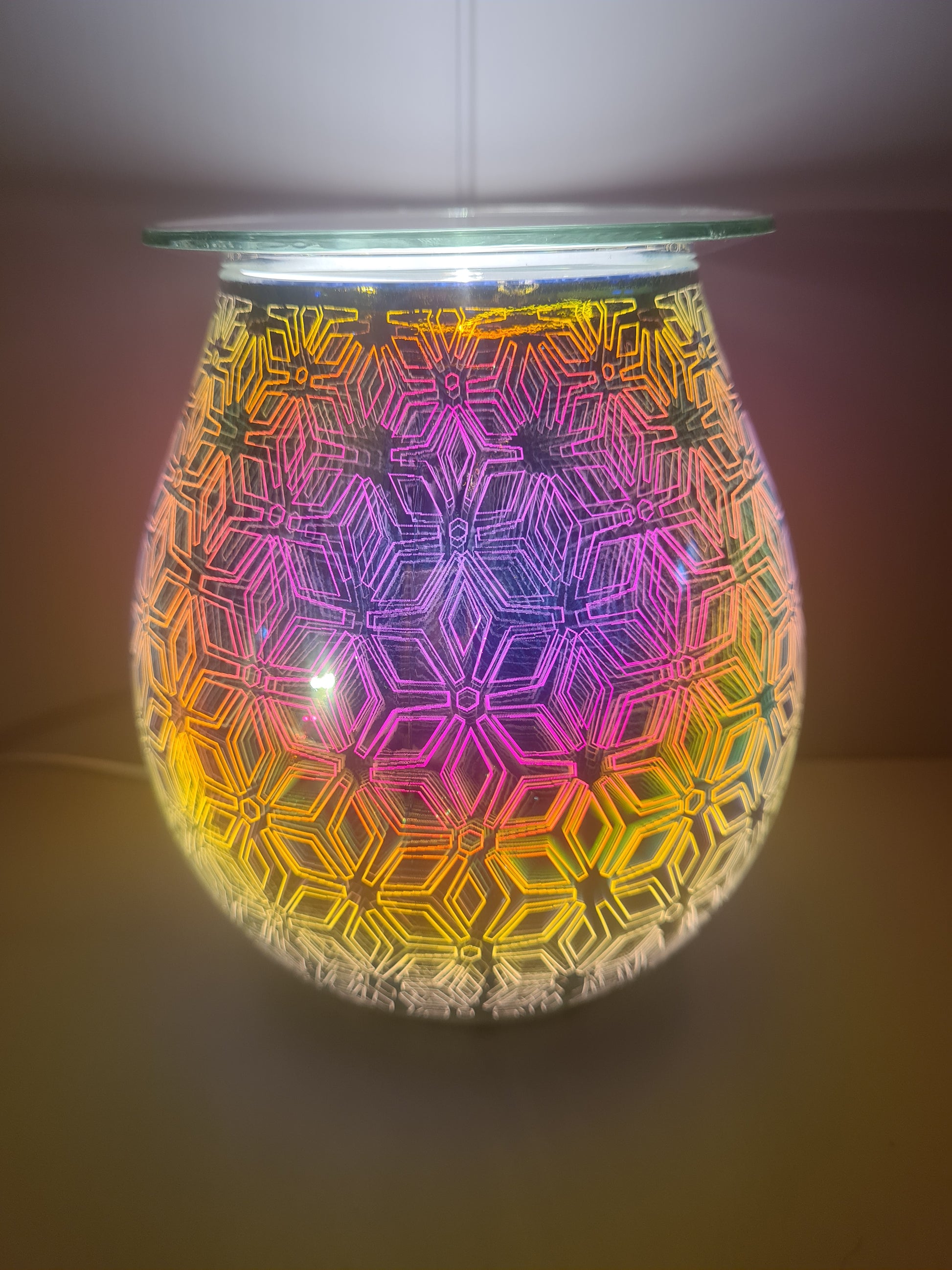 Another view of the lit electric geometric flower warmer