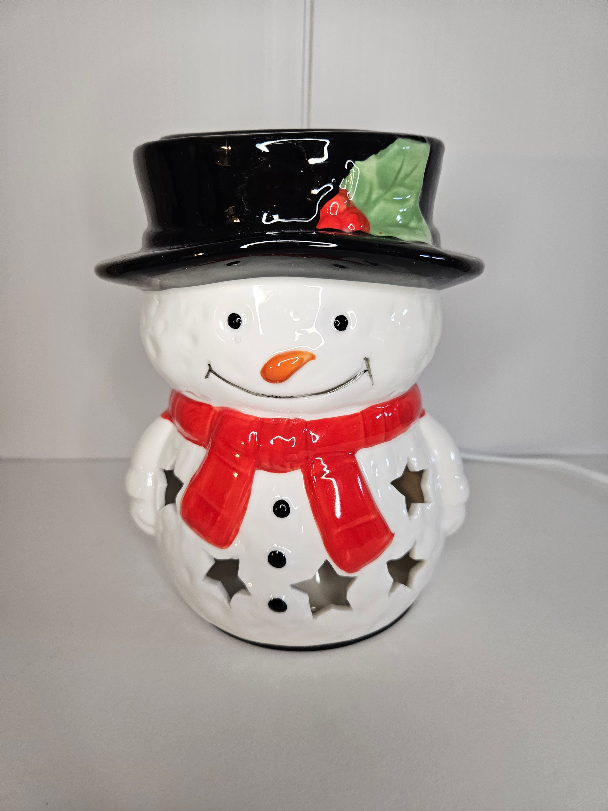 Snowman electric warmer shown not lit