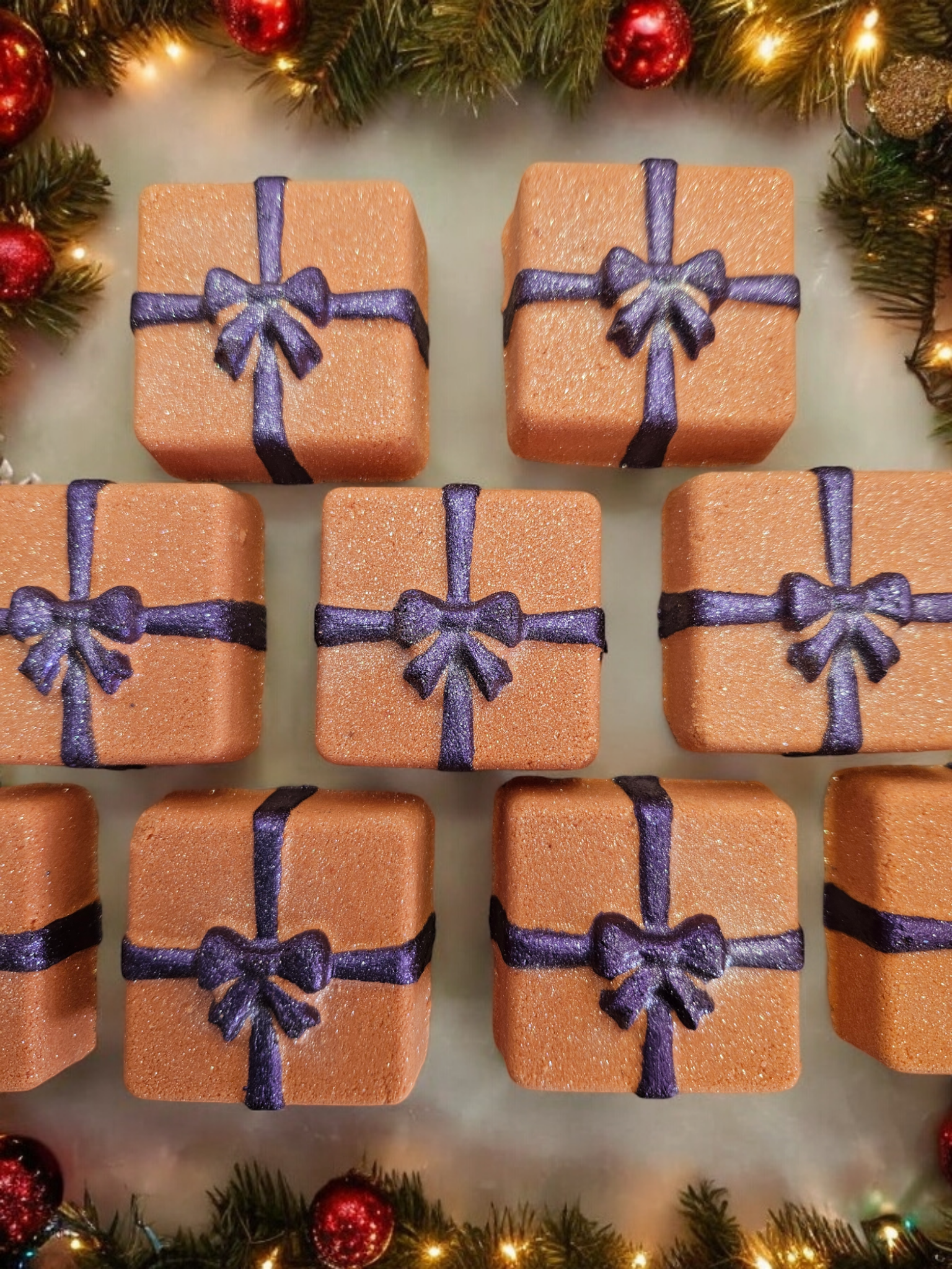 Orange present square shaped with purple ribbon and bow