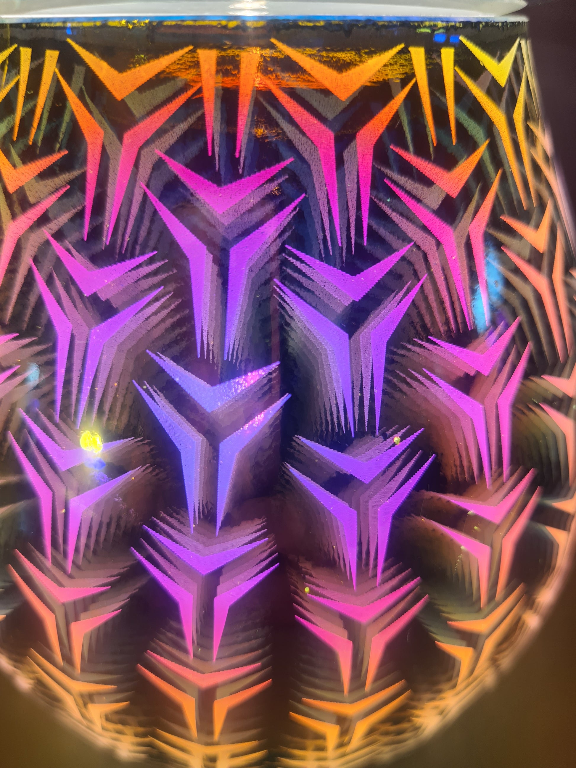 A close up view of the geometric pattern on the aom lamp