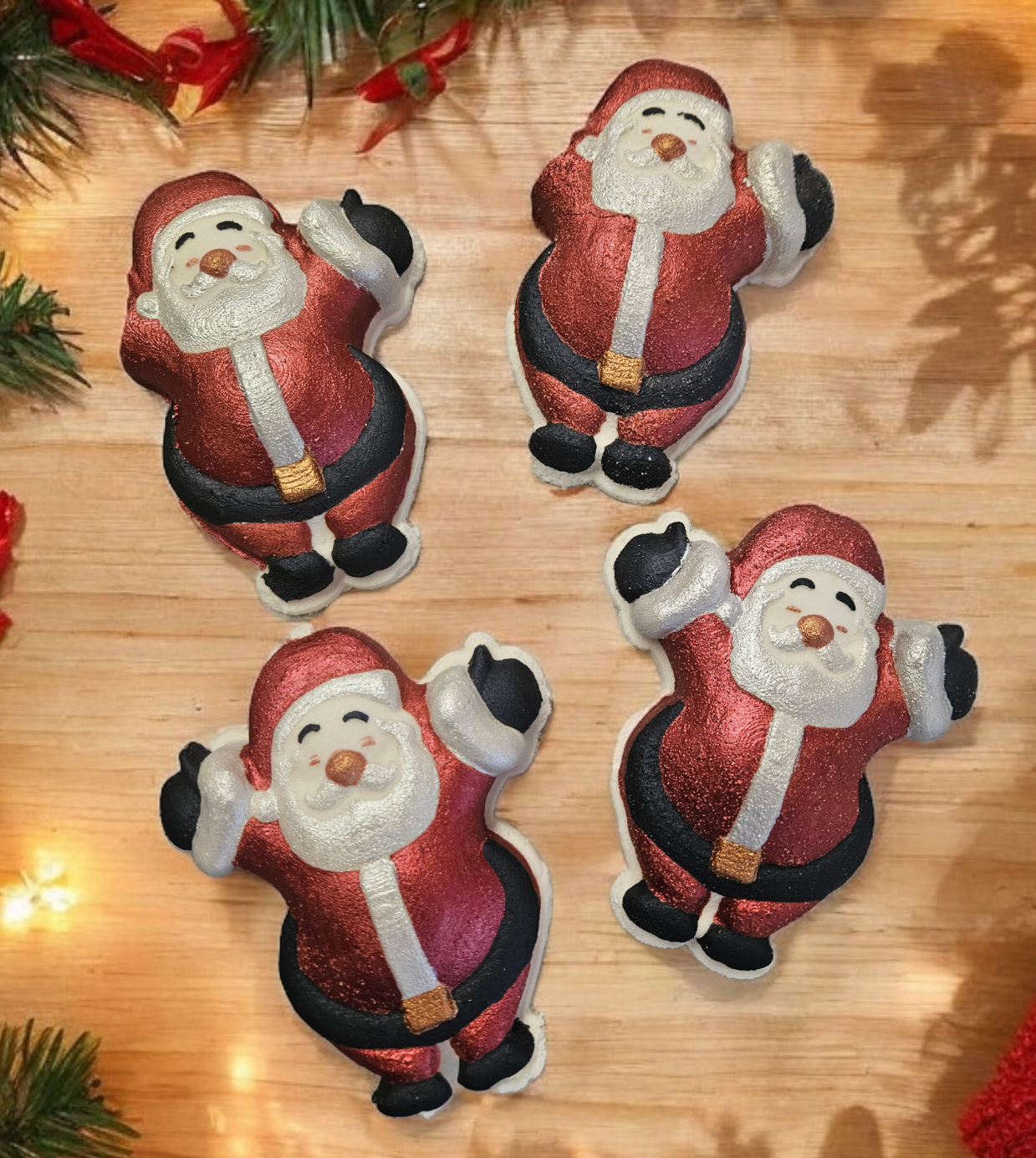 Father Chrismas, santa, shaped bath bomb with the traditional colours of red, white and black