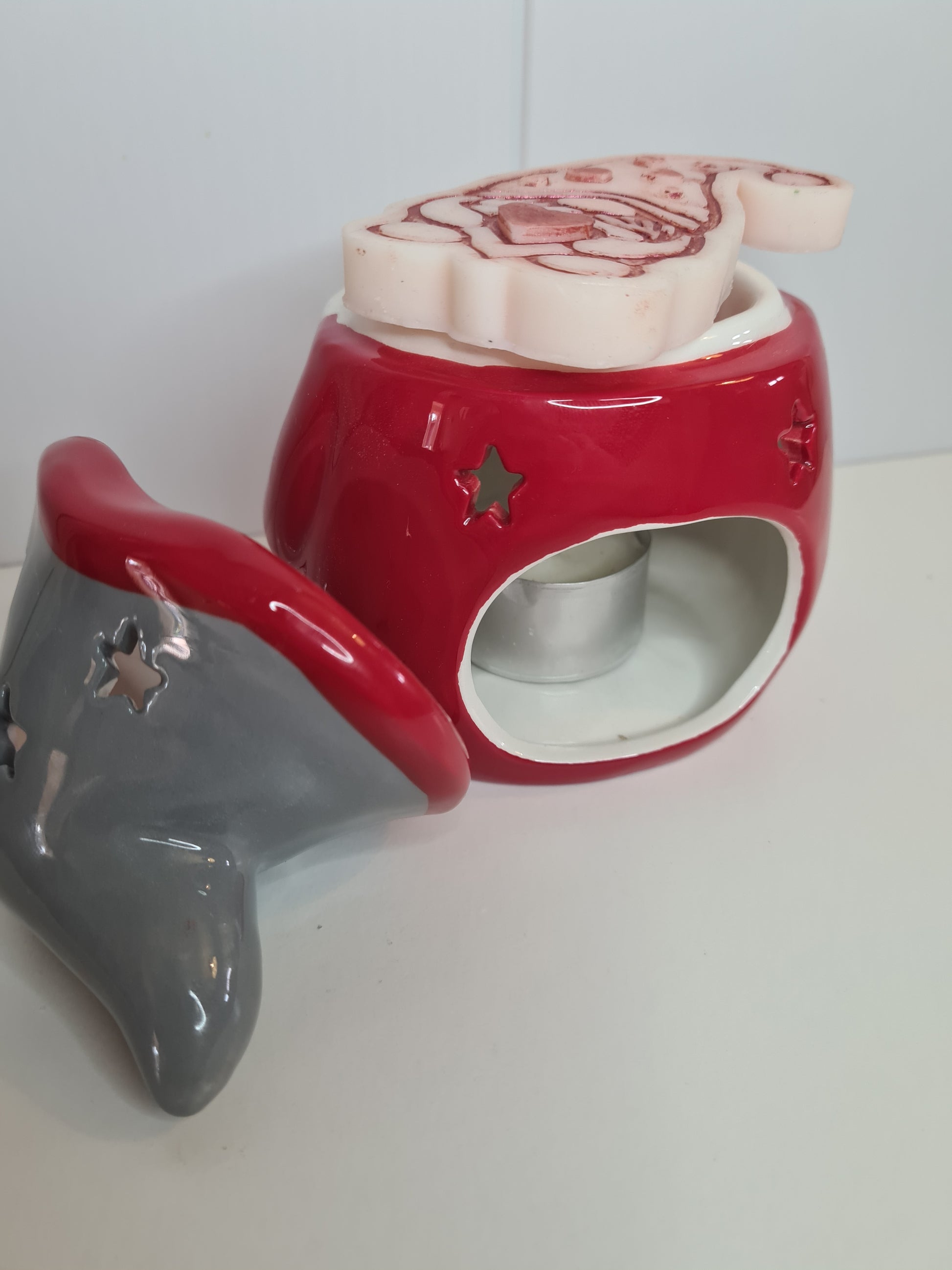 Another view from the side of the gonk wax or oil burner with tea light and gonk wax melt on top