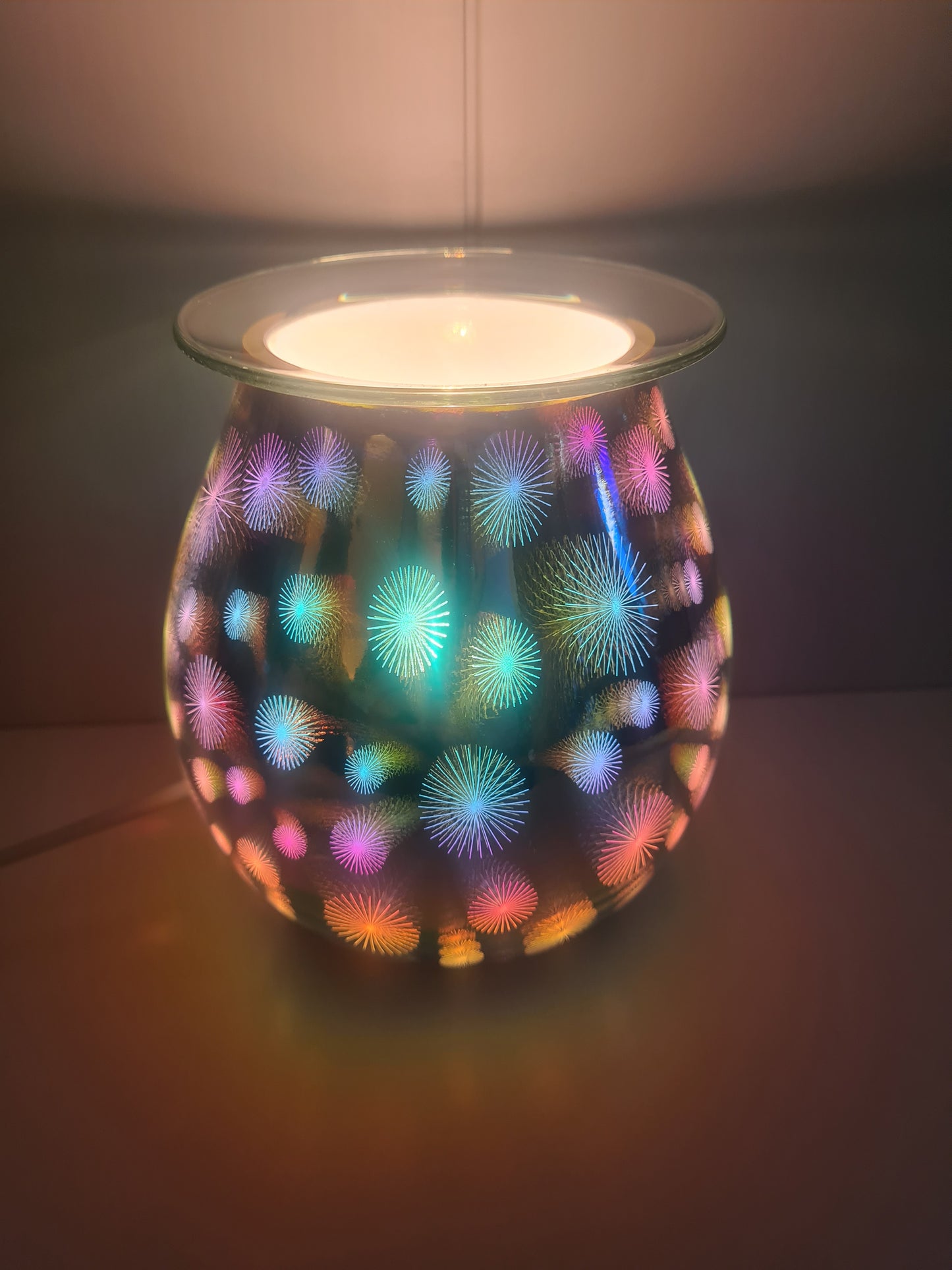 A view of the electric warmer showing it's Starburst pattern when lit