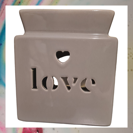 This wax or oil burner is contemporary styled with the word love cut out, would look great around anywhere in the home